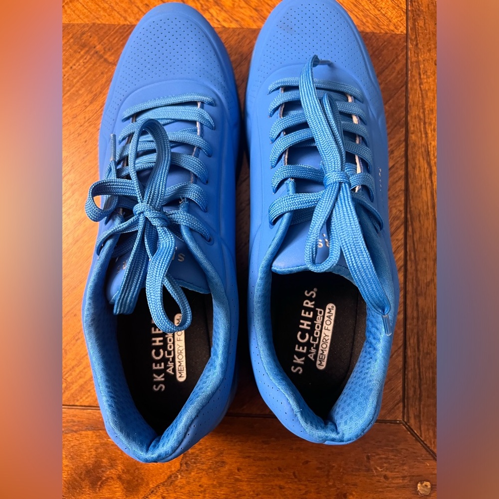 Men’s 11.5 size cobalt blue Skechers sneakers. Never been worn.